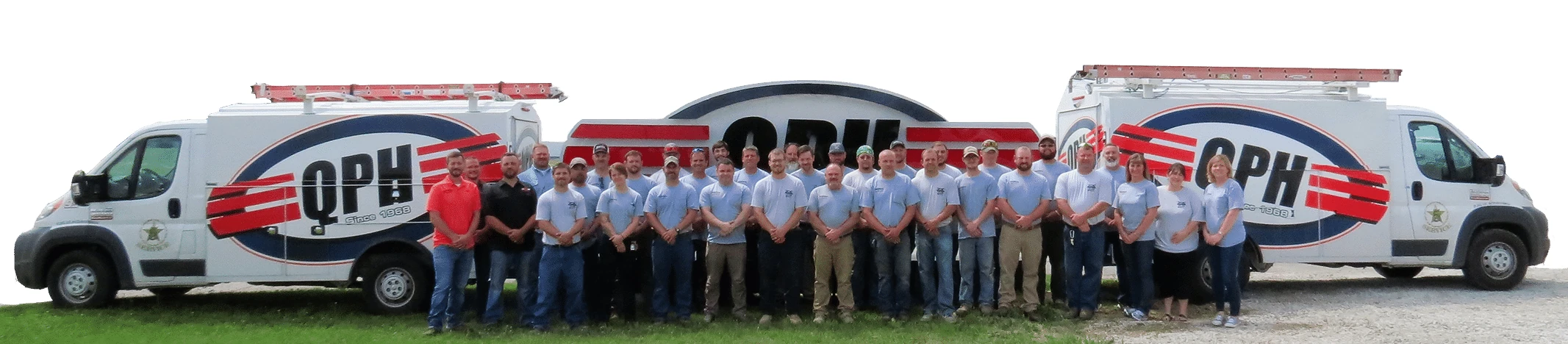 The Quality Plumbing & Heating team in front of QPH service vans